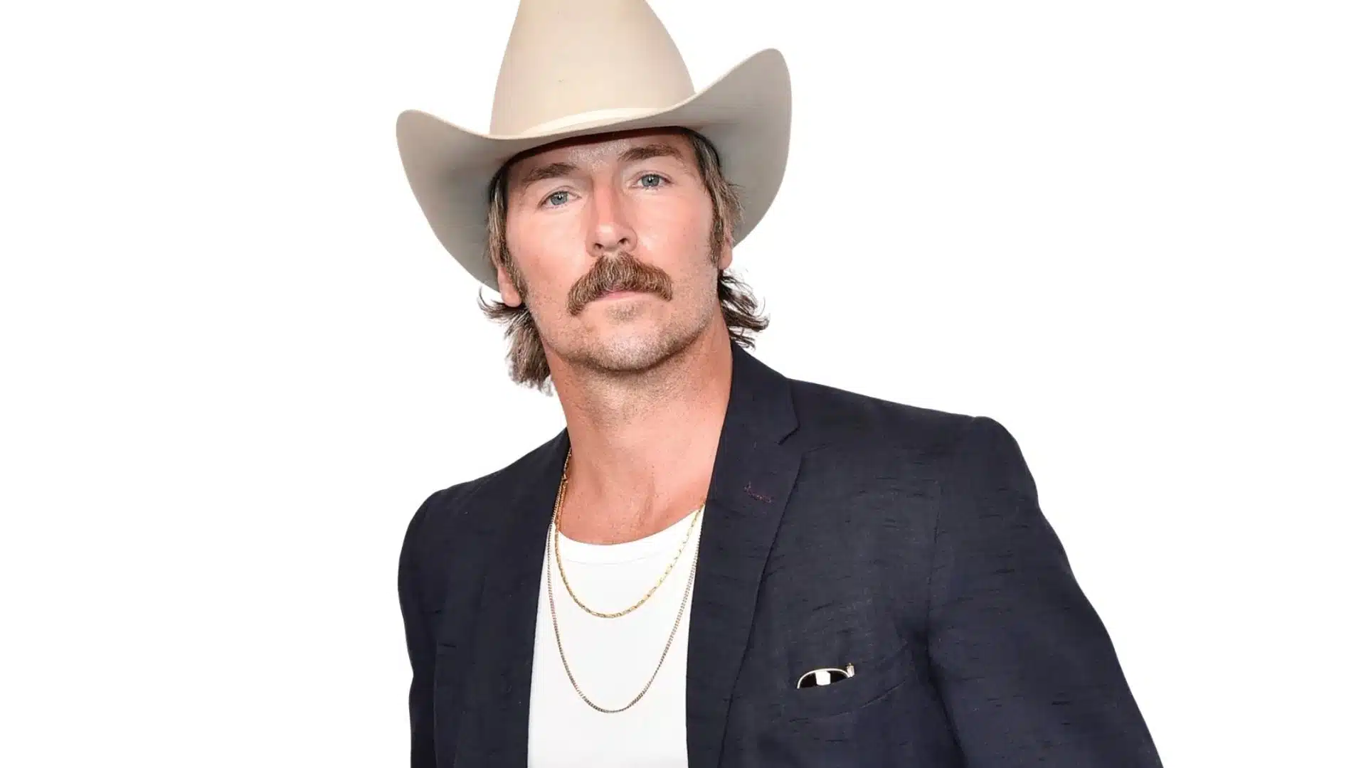 Midland lead singer Mark Wystrach wearing a cowboy hat and blazer.