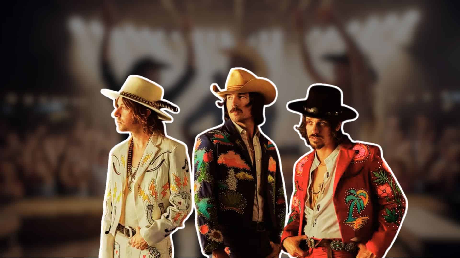 Midland band members in colorful western outfits, cutout over blurred concert crowd background