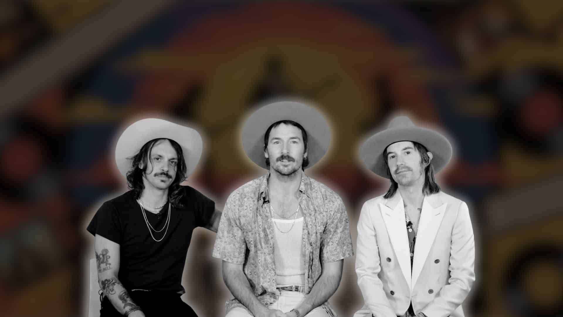 Midland band members seated in hats, black-and-white cutout on colorful blurred background
