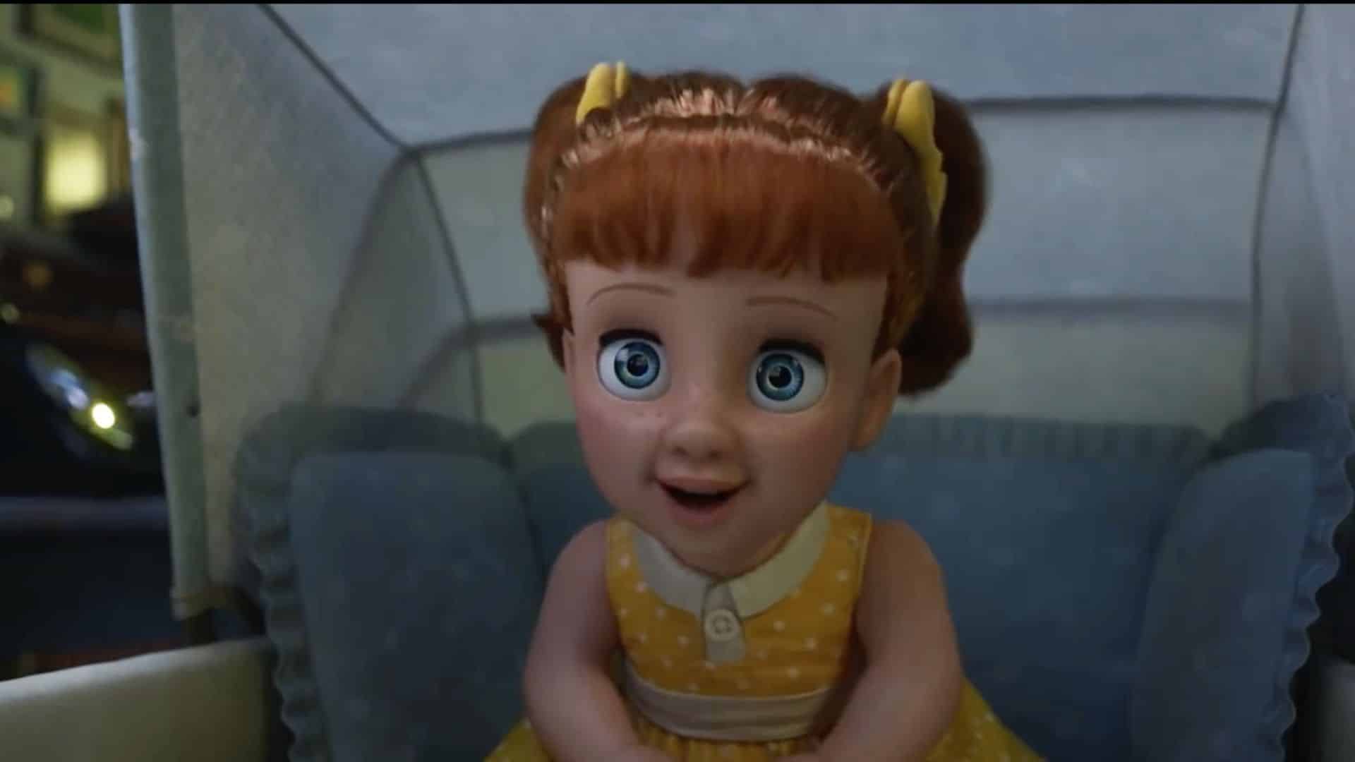 Gabby Gabby, the vintage doll from Toy Story 4, smiling while sitting in a baby carriage.