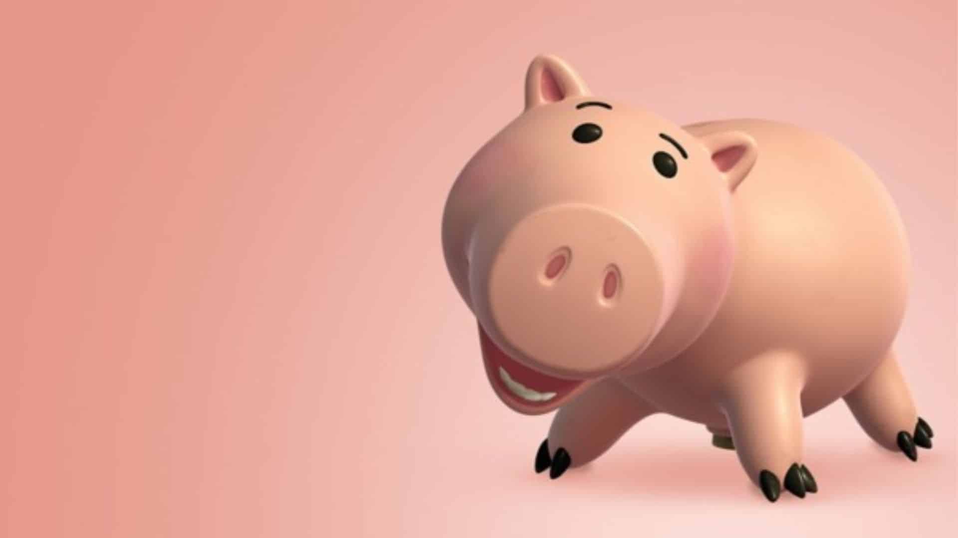 Hamm, the pink piggy bank from Toy Story, smiling against a pink background.