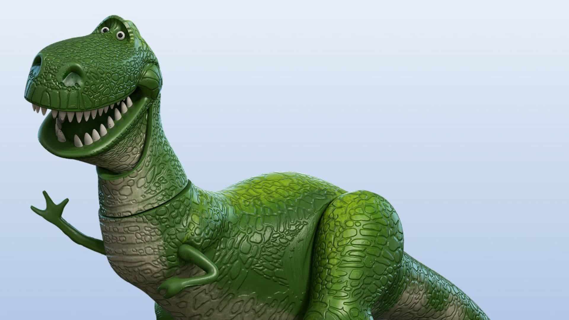 Rex, the green dinosaur toy from Toy Story, smiling and waving with his tiny arms.