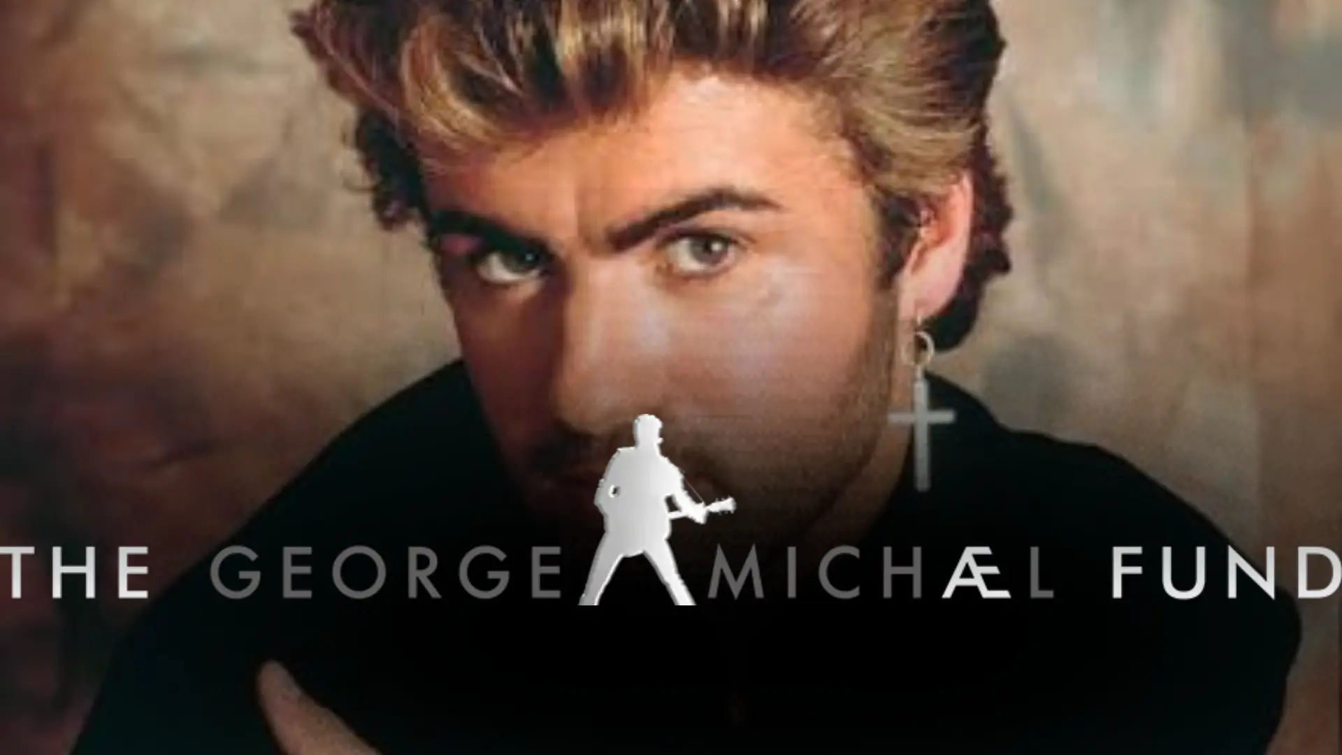 George Michael portrait with charity branding and a silhouette logo representing his philanthropic work.