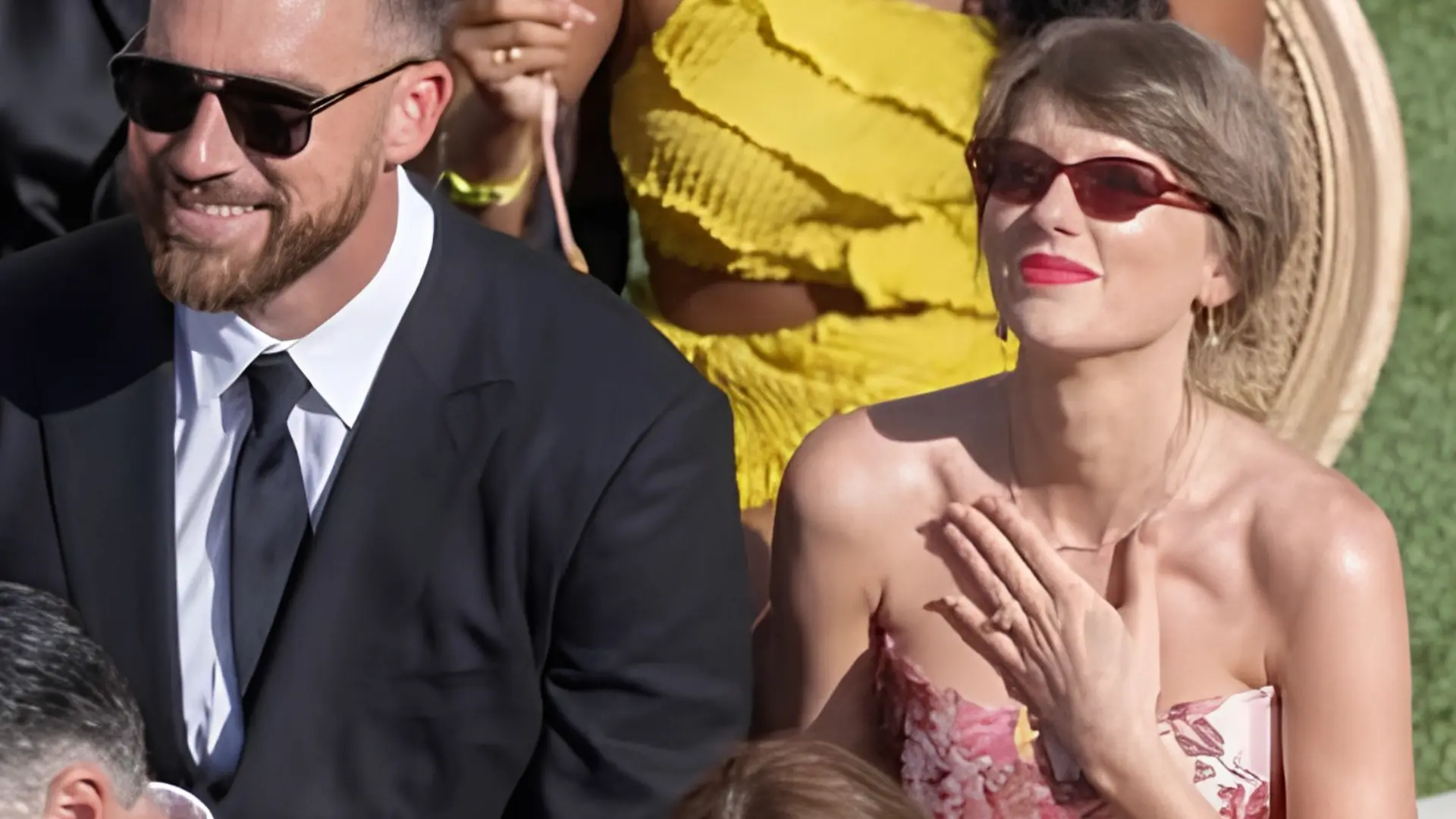 Travis Kelce and Taylor Swift seated as wedding guests at JuJu Smith-Schuster and Laura Kruk's ceremony.