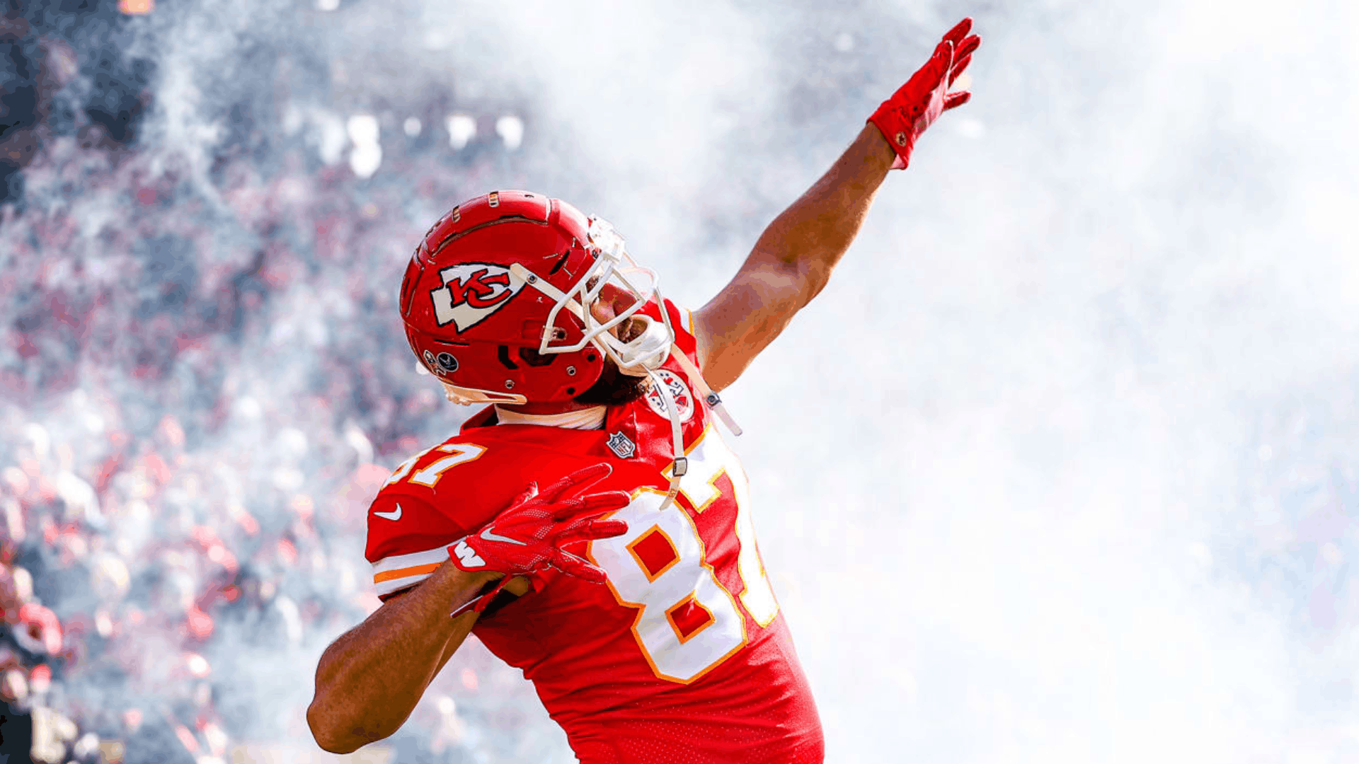 Travis Kelce celebrates in his Kansas City Chiefs uniform during a game-day moment.